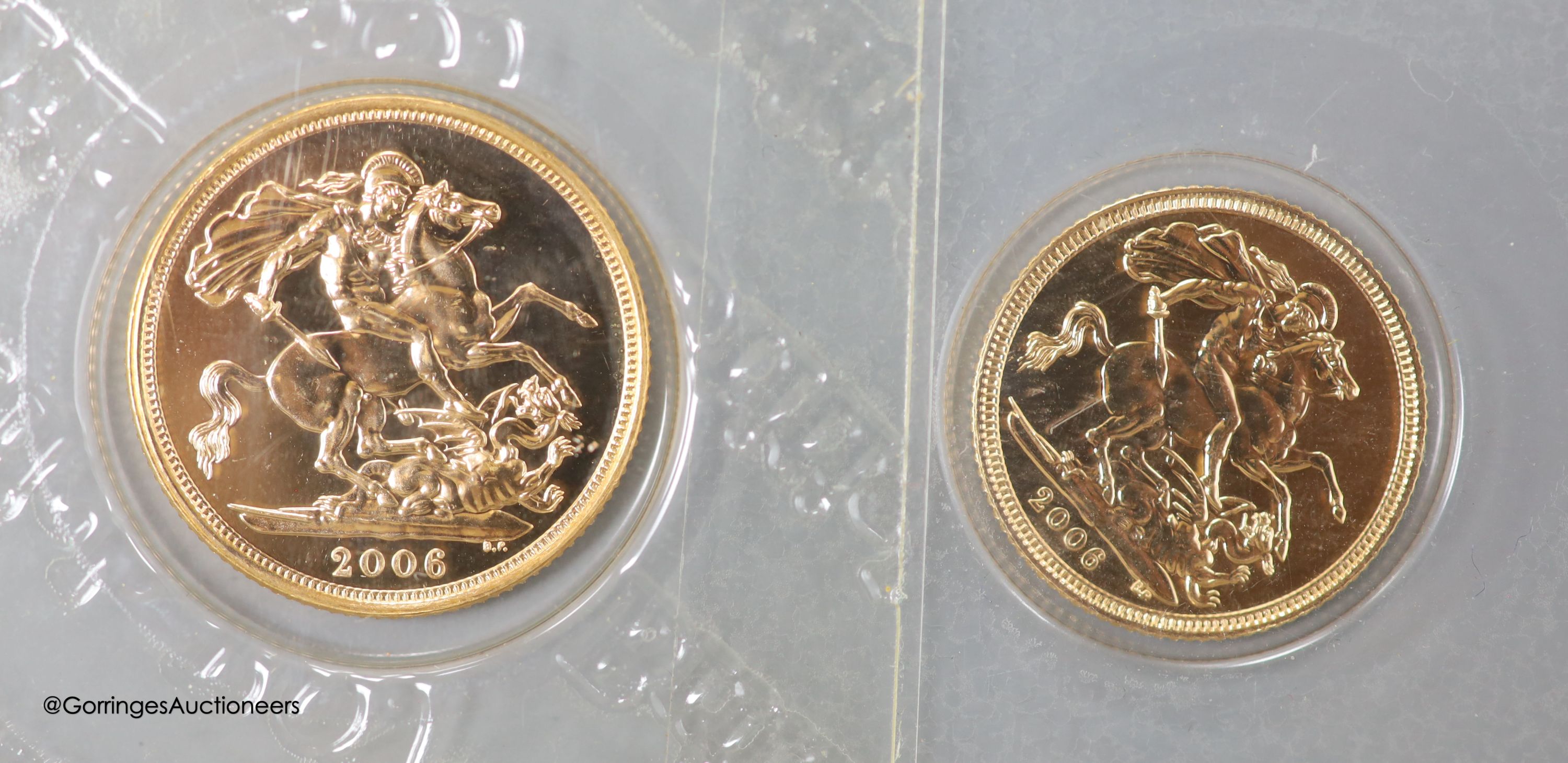 A QEII gold sovereign and half sovereign, 2006.